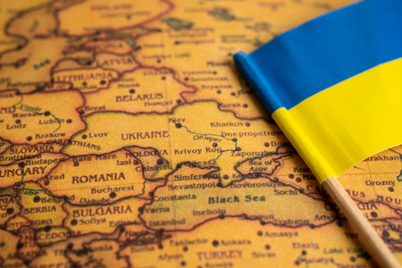 Bangkok, Thailand February 7, 2022, Ukraine flag symbol on world map background.のeditorial素材