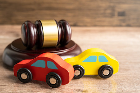 Hammer gavel judge with car vehicle accident, insurance coverage claim lawsuit court case.の写真素材