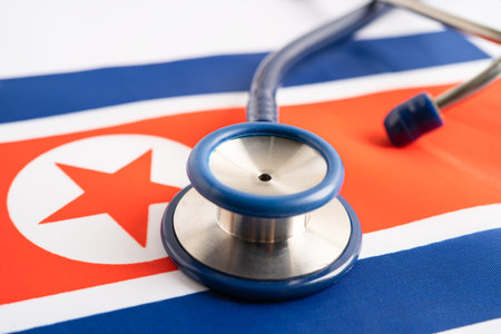 Stethoscope on North Korea flag background, Business and finance concept.の写真素材