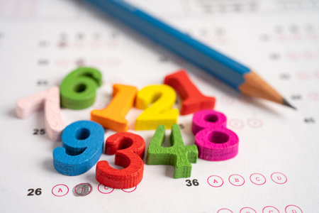 Math number and pencil on answer sheet paper, Education study testing learning teach concept.の写真素材