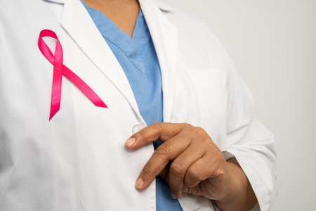 Breast cancer, Asian doctor woman with pink ribbon, symbol of World Breast Cancer Day.の写真素材