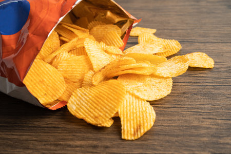 Potato chips, delicious BBQ seasoning spicy for crips, thin slice deep fried snack fast food in open...