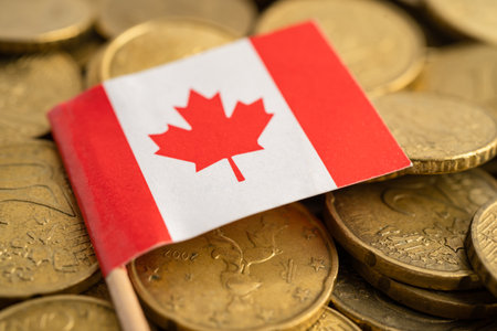 Canada flag on coins money, finance and accounting, banking concept.の写真素材