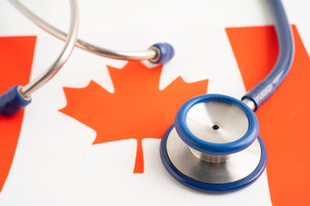 Stethoscope on Canada flag background, Business and finance concept.の写真素材