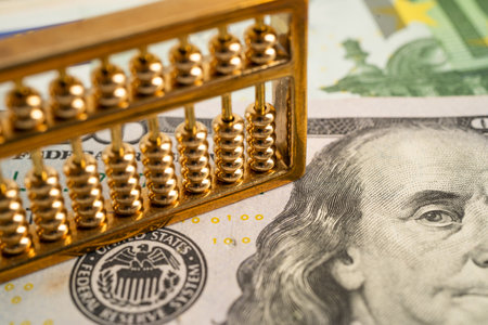 Gold abacus on USA dollar banknote money, economy finance exchange trade investment concept.の写真素材