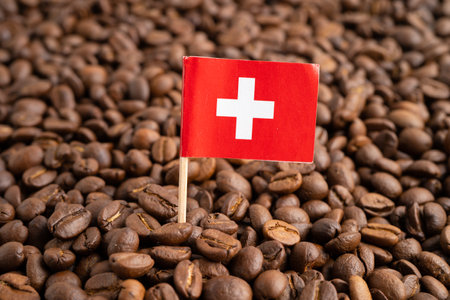 Switzerland flag on coffee bean, import export trade online commerce.の写真素材