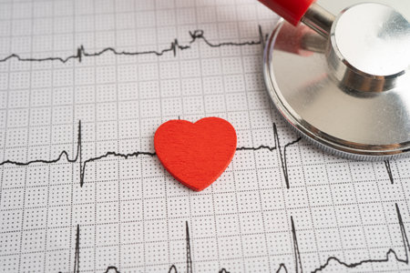 Red heart on electrocardiogram ECG with red heart, heart wave, heart attack, cardiogram report.