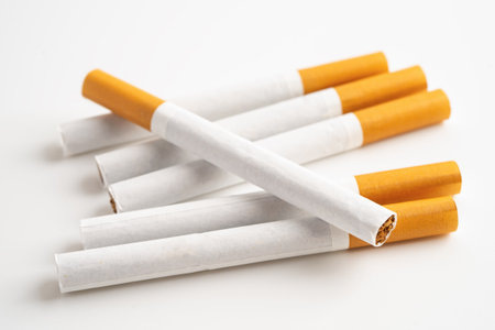 Cigarette on US dollar banknotes, cost, trading, marketing and production, No smoking, import export.の写真素材