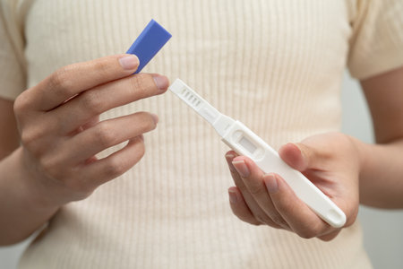 Asian holding pregnancy test for female of ovulation day, fetus, maternity, childbirth, birth...
