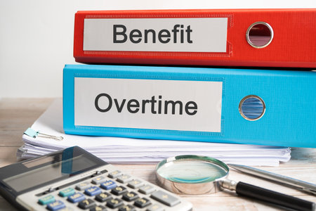 Overtime, Salary. Binder data finance report business with graph analysis in office.