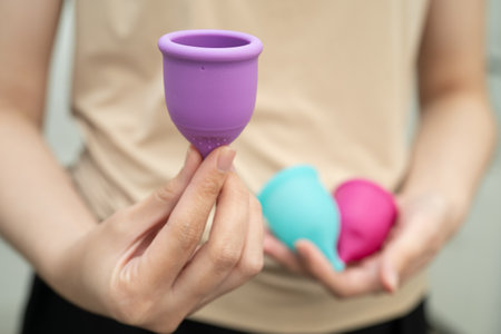 Asian woman holding menstrual cup for hygiene menstrual period cycle protection.の写真素材