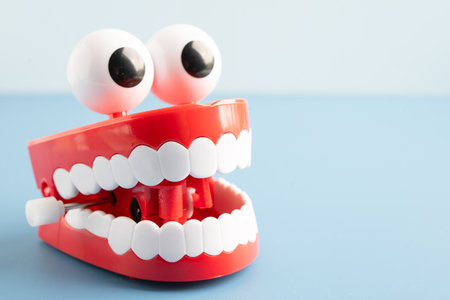 Tooth funny toy denture red color jaw and eye.