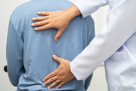Physical therapy, Asian therapist doctor treat perform pain young man in hospital.