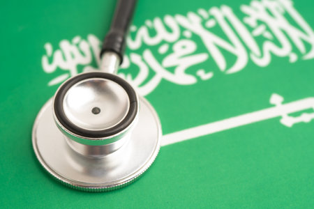 Stethoscope on Saudi Arabia flag background, Business and finance.の写真素材