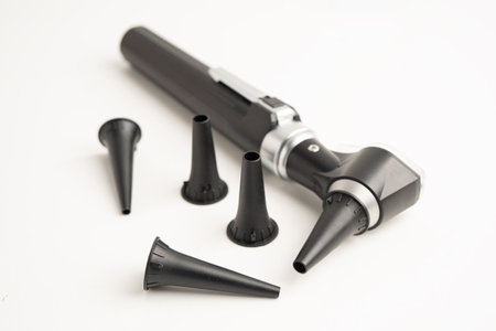 Otoscope with model for audiologist or ENT doctor use otoscope checking ear and treat hearing loss problem.の写真素材