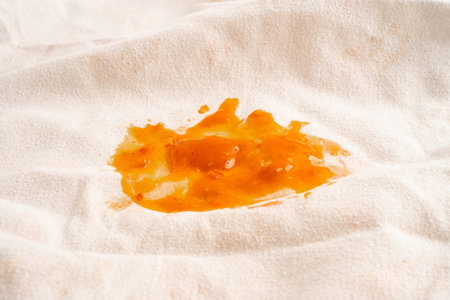 Dirty tomato sauce stain or ketchup on cloth to wash with washing powder, cleaning housework.の写真素材