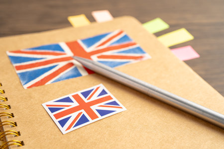 UK flag with pen on english language book.の写真素材