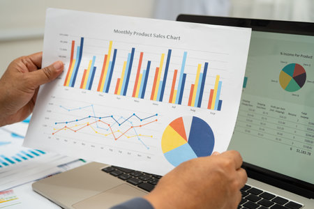 Asian business woman working with financial graph.の写真素材