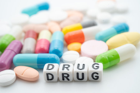 Drug word with pills and capsules medical drug.の写真素材