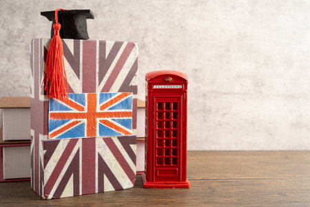 UK flag with graduate hat on english language book.の写真素材