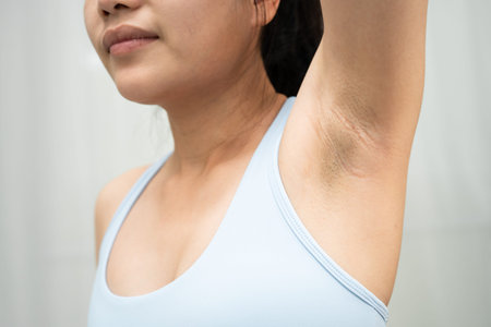 Asian woman armpit skin care.