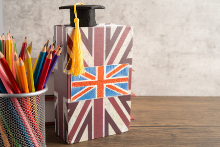 UK flag with graduate hat on english language book.の写真素材