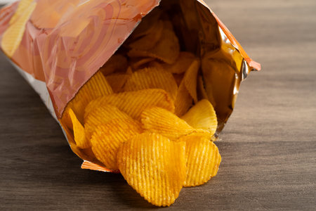 Potato chips, delicious BBQ seasoning spicy for crips, thin slice deep fried snack fast food in open...