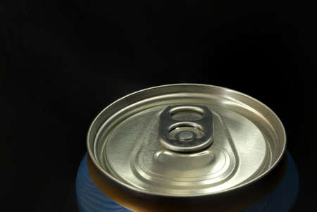 closed beer can on black background