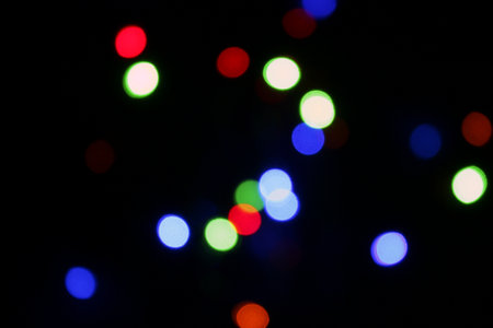 Photo of blurry Christmas lights at night.