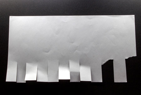 Blank white paper with tear-off tabsの写真素材