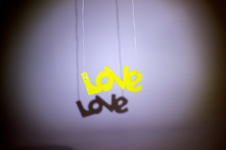 Love message hanging on a string. concept of love and romance.の写真素材