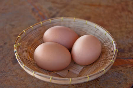 Chicken eggs in basket