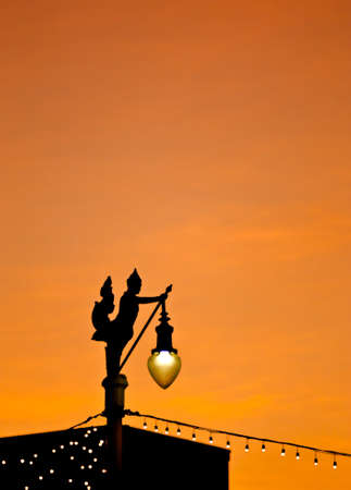 Silhouette view of Thai style light pole  under twilight skyの写真素材