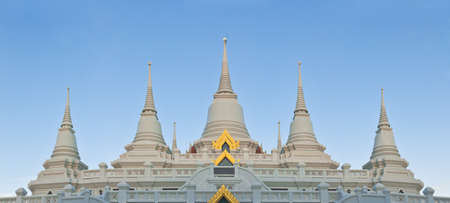 Panorama view of Thai Buddhism style pagoda in Buddhist temple under blue skyの写真素材