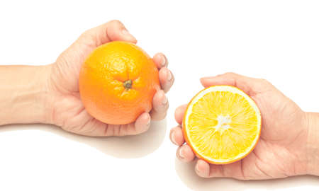 Mandarin oranges in hands isolated on white backgroundの写真素材