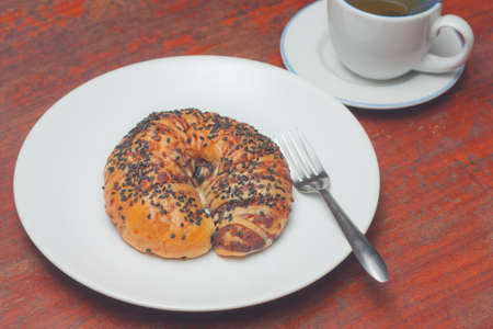 Croissant bun with black sesame toppingの写真素材