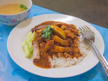 Chinese style fried pork and rice poured with sweetly sauceの写真素材