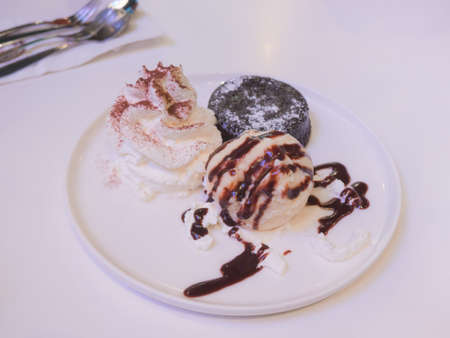 Set of vanilla ice-cream and chocolate brownieの写真素材