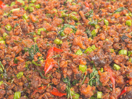 Closeup of Thai style pound crunchy fish fried with hot chili and herbsの写真素材