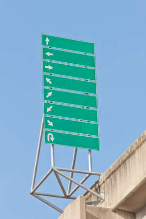 Green traffic signs with multi direction arrowsの写真素材