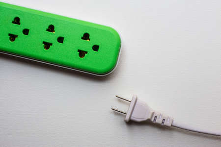 power outlet and power plug on white backgroundの写真素材