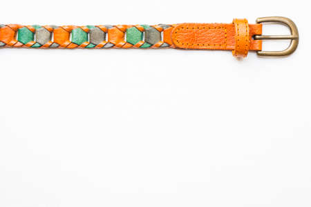 Close up of leather knitted belt on white canvas backgroundの写真素材