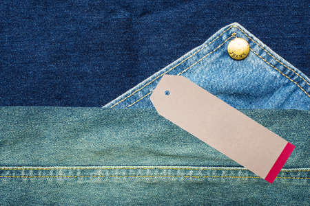 Denim jeans background with seam of jeans fashion design and tagの写真素材