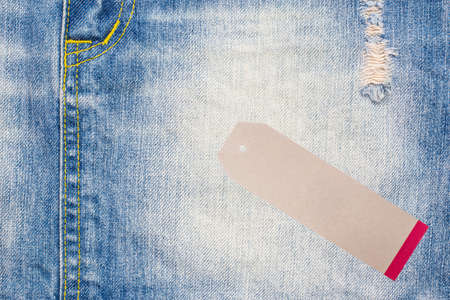 Denim jeans background with seam of jeans fashion design and tag