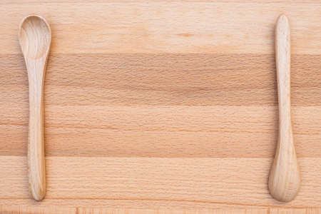 close up of wooden spoon on wooden backgroundの写真素材