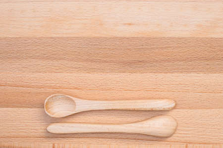 close up of wooden spoon on wooden backgroundの写真素材