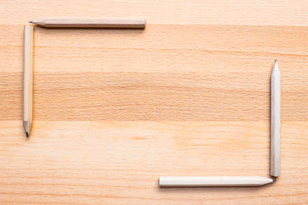 close up of pencils on wooden background