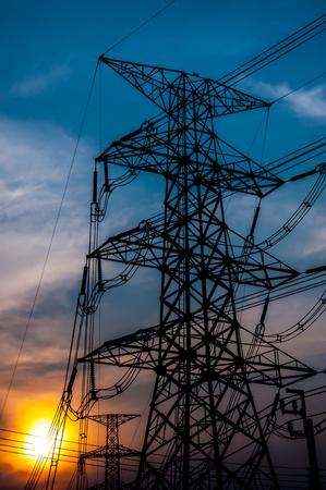 Electric high transmission and sky  at sunset timeの写真素材