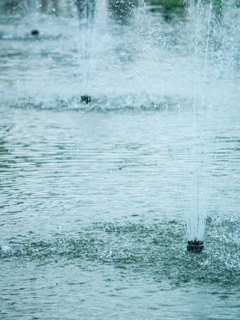 3 fountain sprinkle in the park pondの写真素材