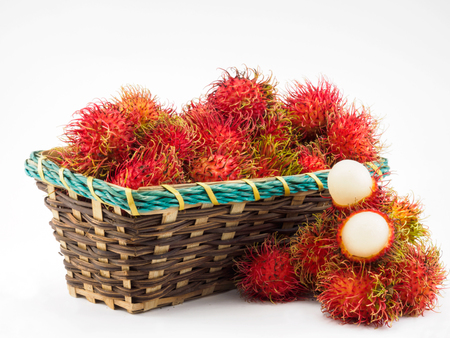 Rambutan in basket on the white background.の写真素材
